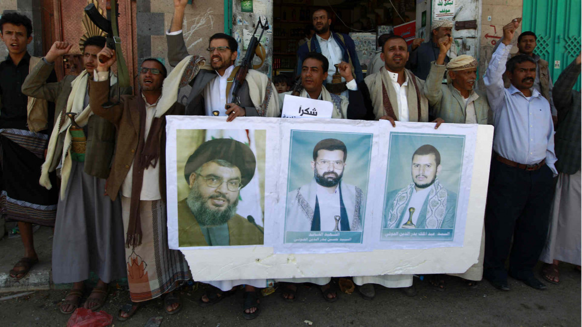 Houthi rebels carrying Hezbollah posters
