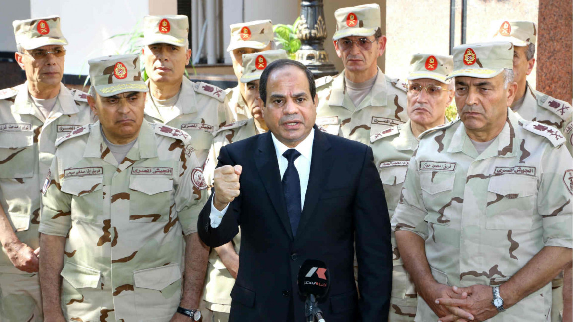 Sisi gives a speech after speaking with military officers