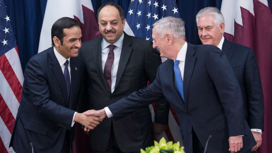 US defense secretary shakes hands with Qatari foreign minister