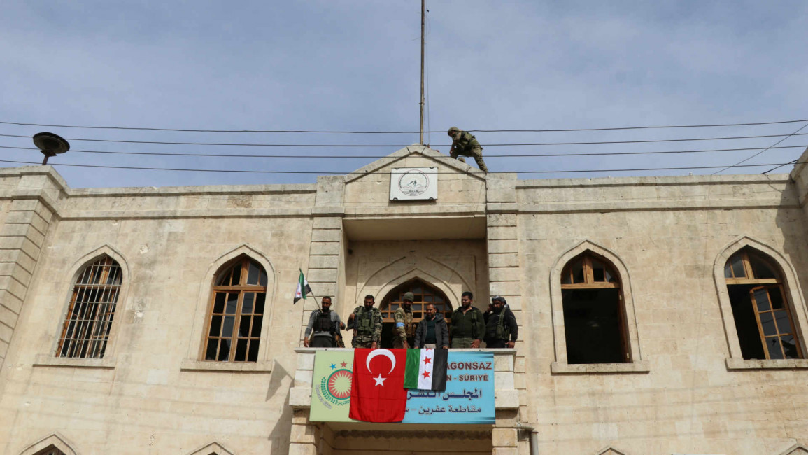 Turkish flag hoisted in Afrin town center - Getty