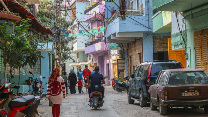 The main street of al Qalamoun, lined with cafes and houses whose facades have been repainted by the NGO, Utopia. North Lebanon, 12 November 2022 [photo credit: Phillipe Pernot]