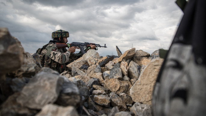 An Indian army soldier during a gun battle in Khudwani village located in Indian-administered Kashmir on 11 April, 2018.  Title: Indian army soldier