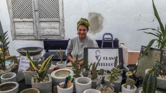 Rania Dridi, 27 years old, from Tunis. She exposed her pots and plants at the Souk'hounna market of the Festival. 