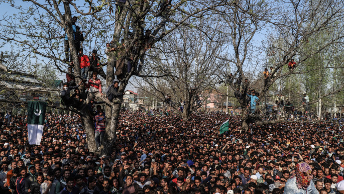 People gather for the funeral of local rebel Zubair Turray in Shopian town in Indian-administered Kashmir on 1 April, 2018 