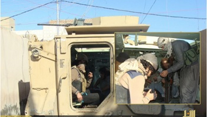 ISIS troops in the back of an armoured personnel carrier in Ramadi