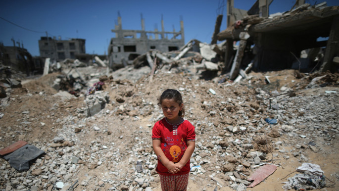 A young Palestinian girl in Gaza following the 2014 Israeli war. [Getty]
